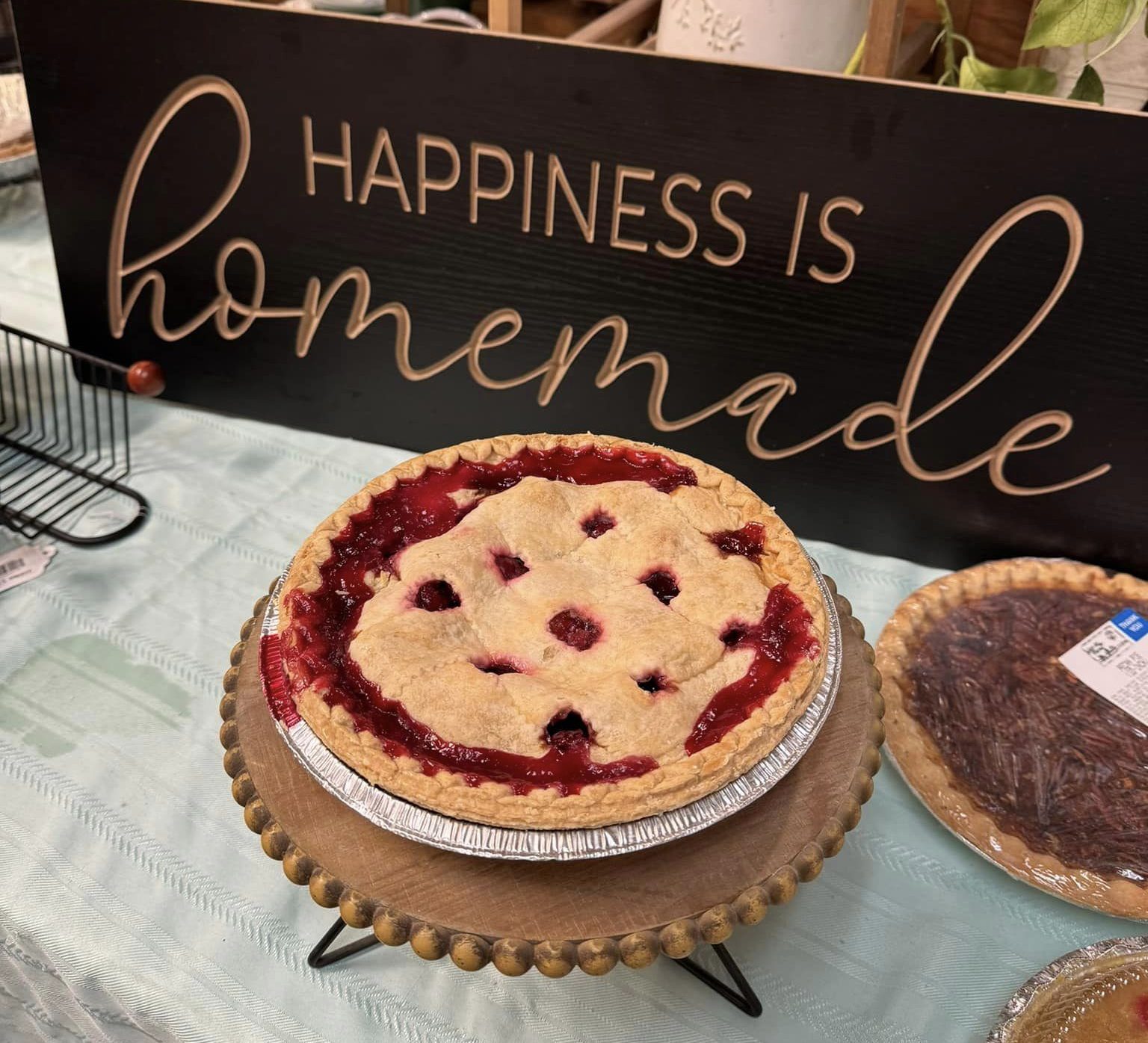 homemade berry pie overflowing with filling